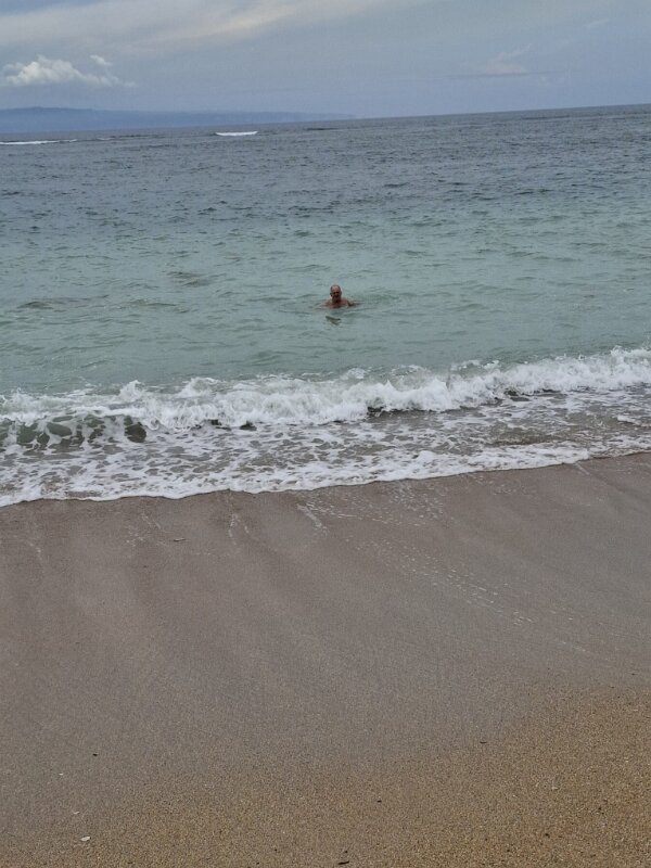Bali - Beach 8 - Kiffin swimming in the nice warm water.