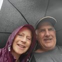 Bali - Taking protective cover under the torrential rain.
