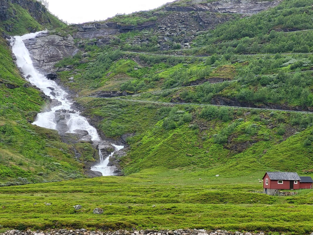 Road trip - Waterfall and small cabin.